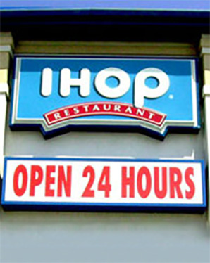 IHOP cabinet sign displayed during the day.